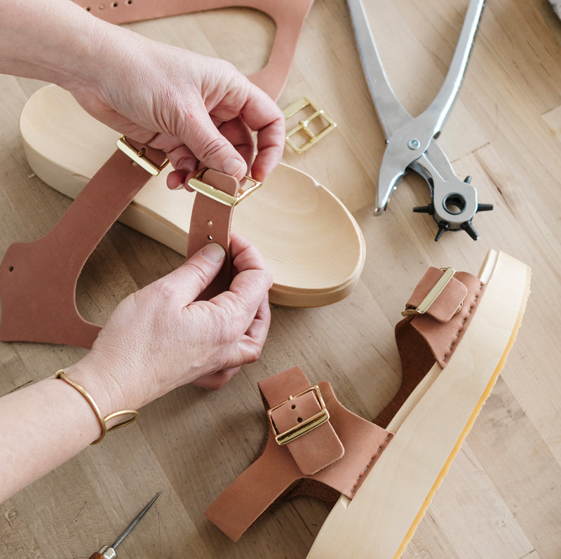 Handmade mobile showcasing craftsmanship, celebrating the artistry of handcrafted shoes