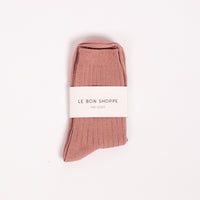 Her Socks in Desert Rose