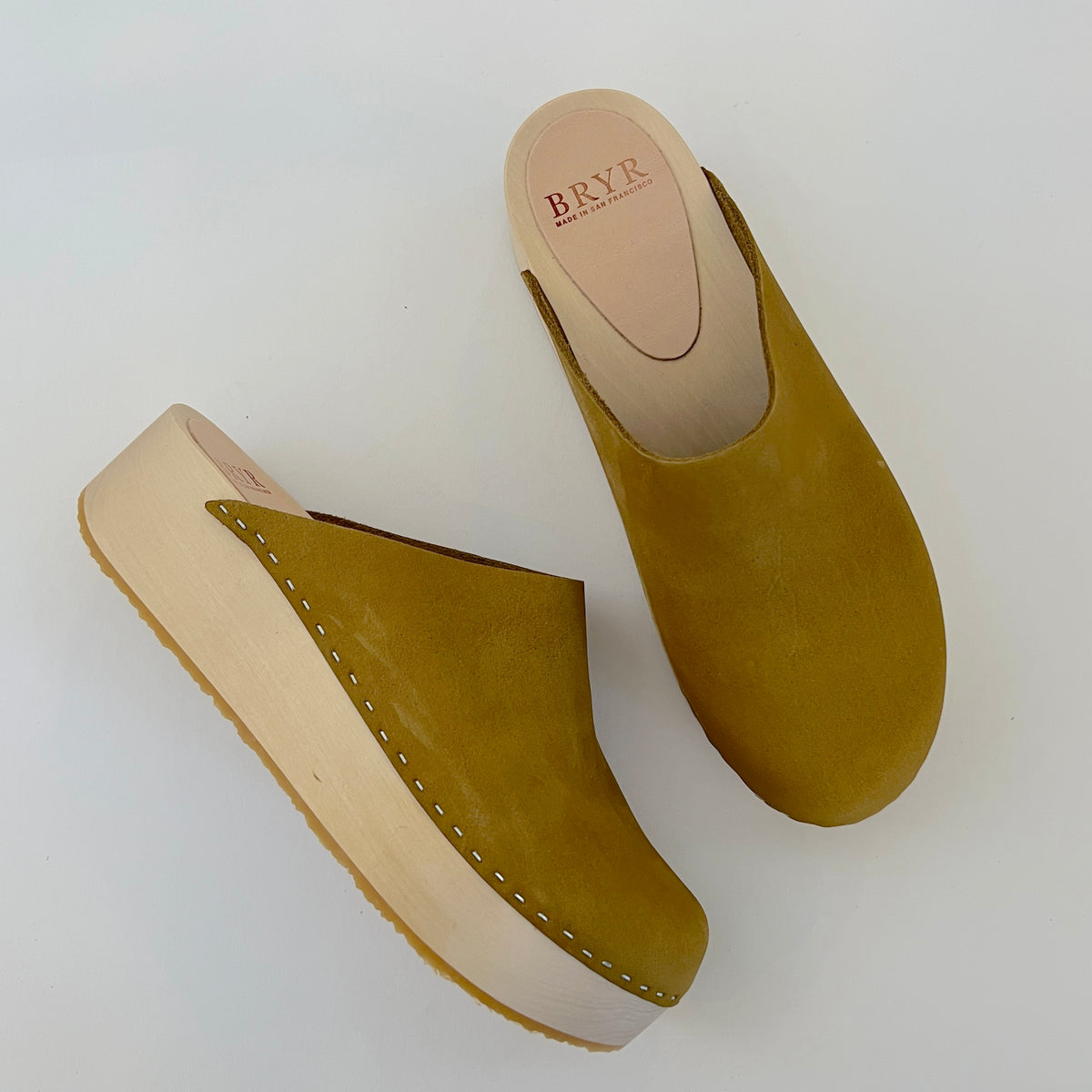 Bean sandals in fennel, a soft, earthy green tone ideal for understated elegance